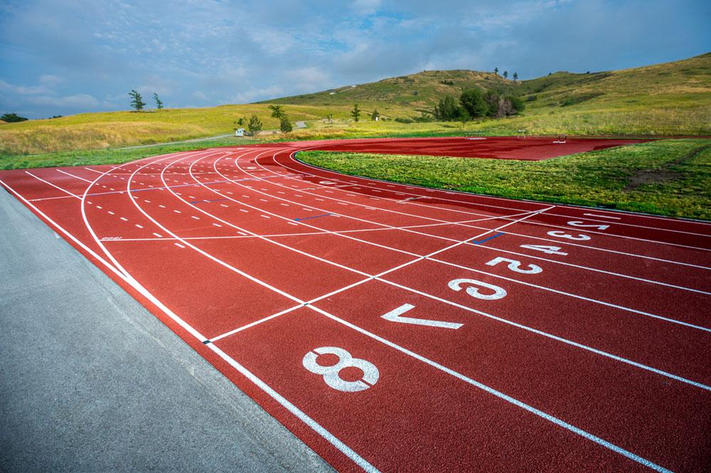 Outdoor Track starting line with C-Hill in the background